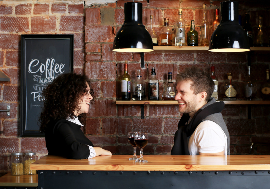 couple in bar talking and laughing responses to pick up lines