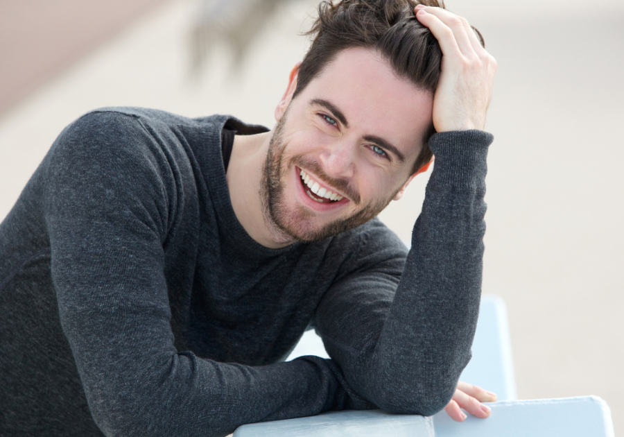 man smiling posing for camera Conventionally Attractive