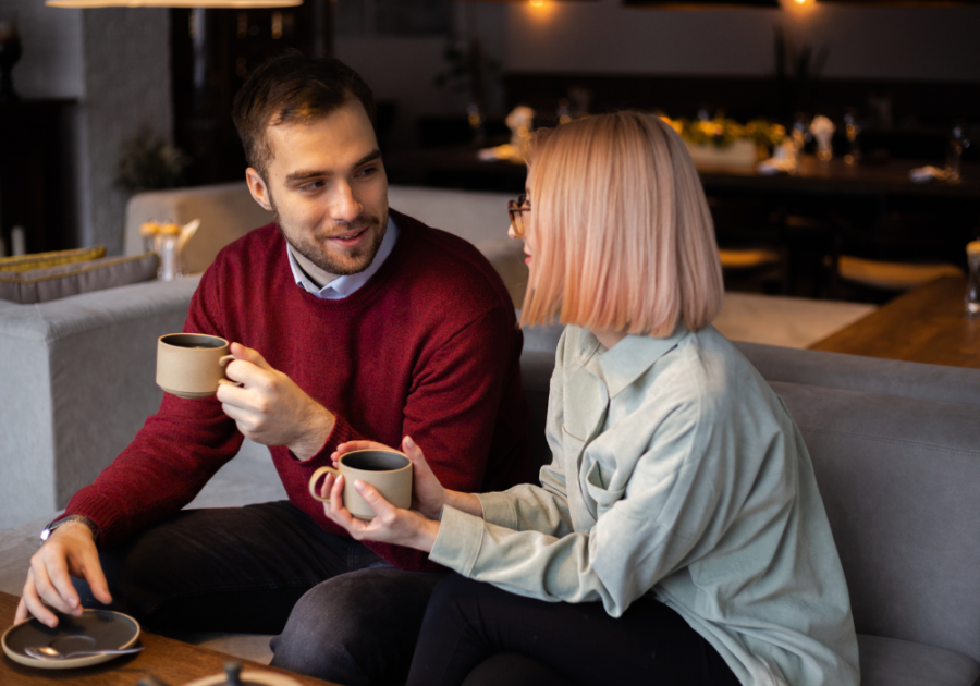 couple sitting on sofa Couple Questions Game