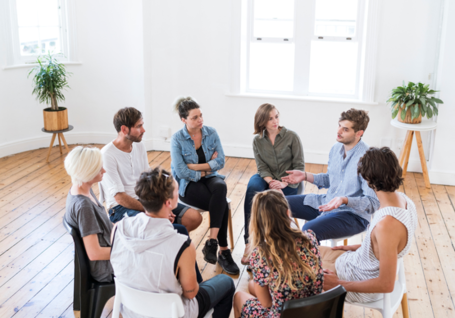 group sitting in a circle how to Stop Talking So Much