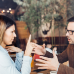 couple arguing at table signs of a Condescending Person