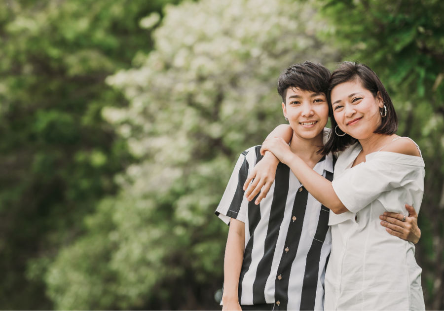 two women smiling with arms around each other Types of Lesbians