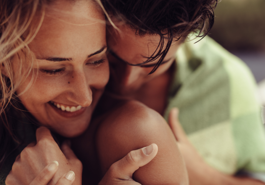 man hugging her from behind Signs of an Aries Man in Love