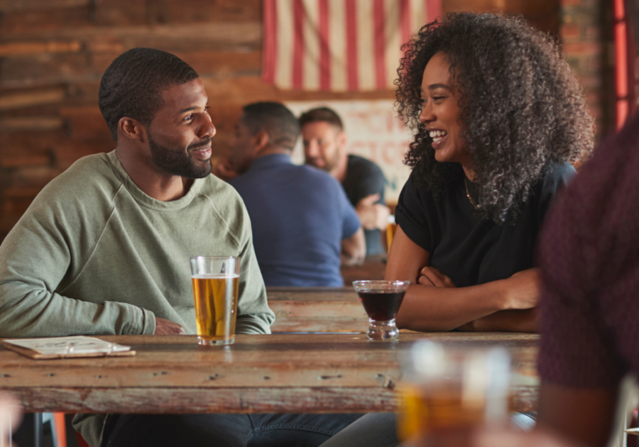 couple talking at bar responses to pick up lines