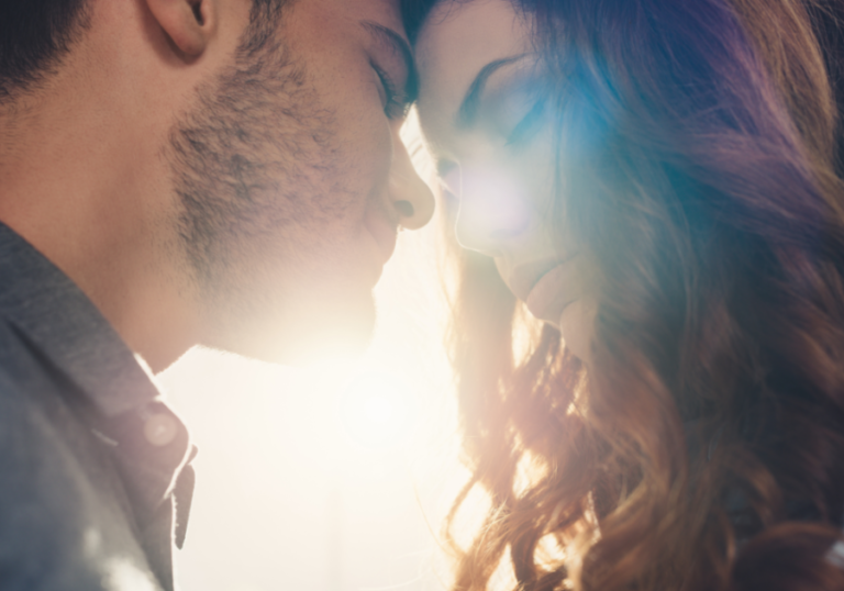 couple face to face in sunlight Psychology Facts About Love