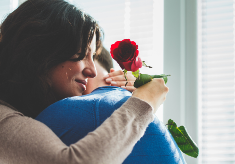 couple hugging woman has rose Unconditional Love Symbols