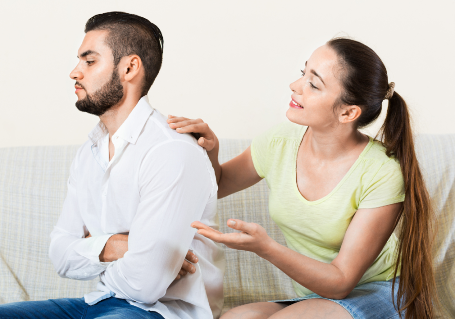 couple on sofa man has back turned How To Tell Someone You Just Want To Be Friends