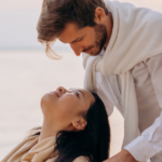 man looking at woman who is leaning back signs that a scorpio man has feelings for you