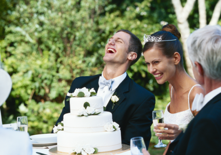 wedding couple laughing at table funny marriage advice for newlyweds