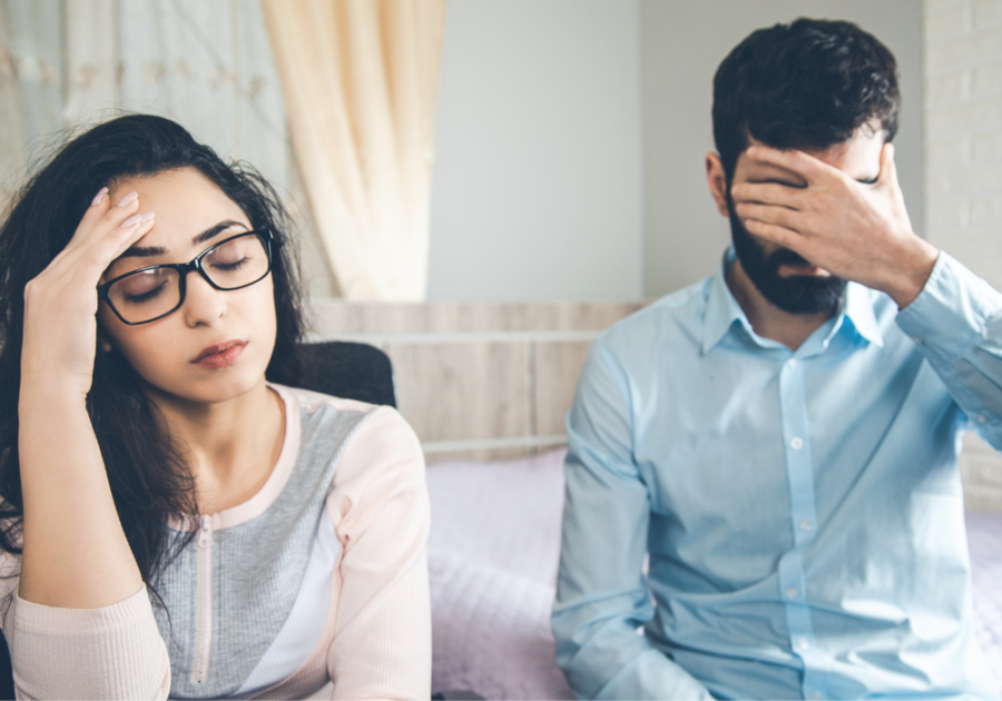 couple in pain sitting together  Falling Out of Love After Infidelity