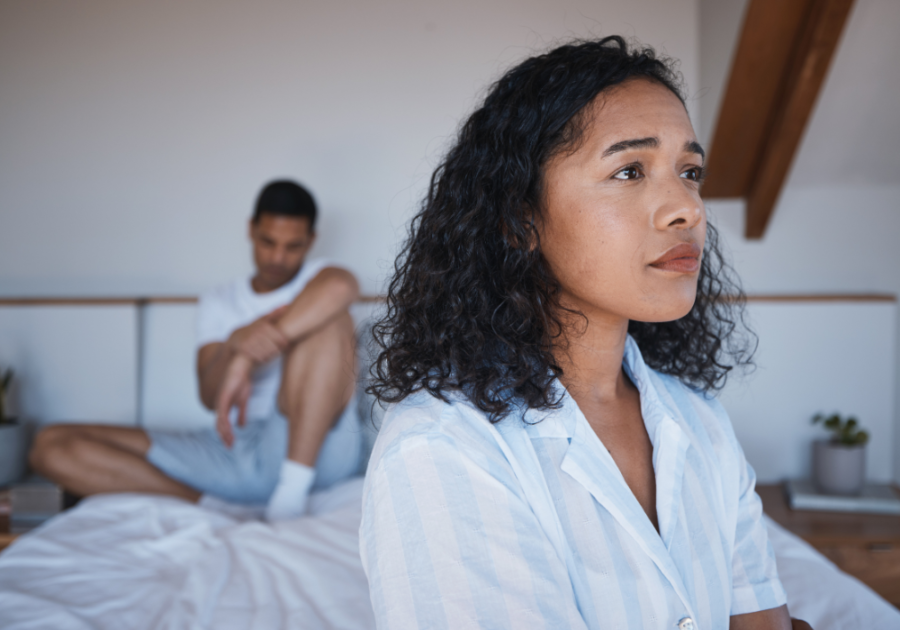 woman sitting away from man at end of bed Boyfriend Cheated on Me