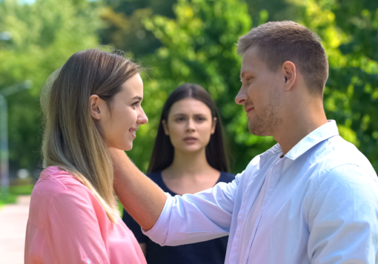 man standing face to face with woman Signs Your Boyfriend Likes His Female Friend