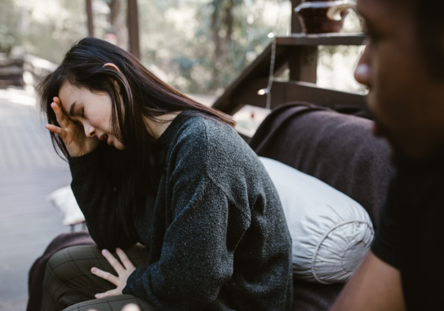 woman sitting sad on sofa How a Man Feels When He Hurts a Woman: