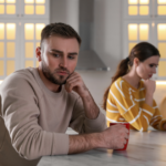 couple sitting not talking How a Man Feels When He Hurts a Woman: