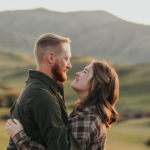 man and woman hugging in mountains Do Guys Like Being Called Handsome