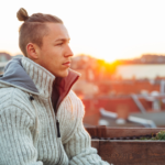 man sitting alone Signs of a Zeta Male