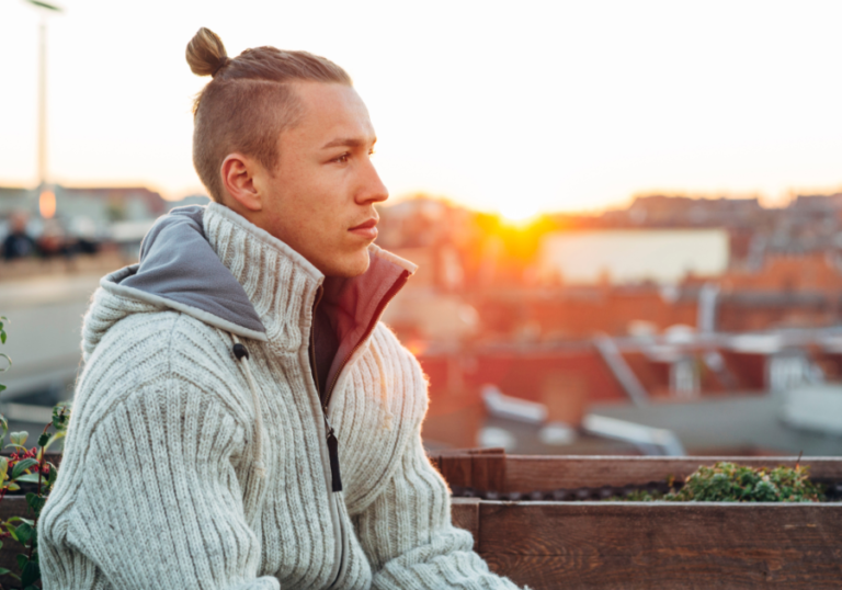 man sitting alone Signs of a Zeta Male