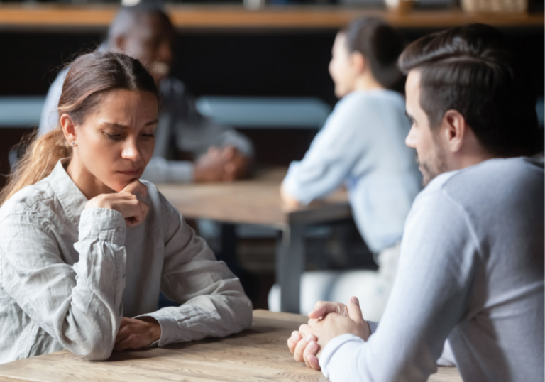 couple sitting at table sociopath weaknesses