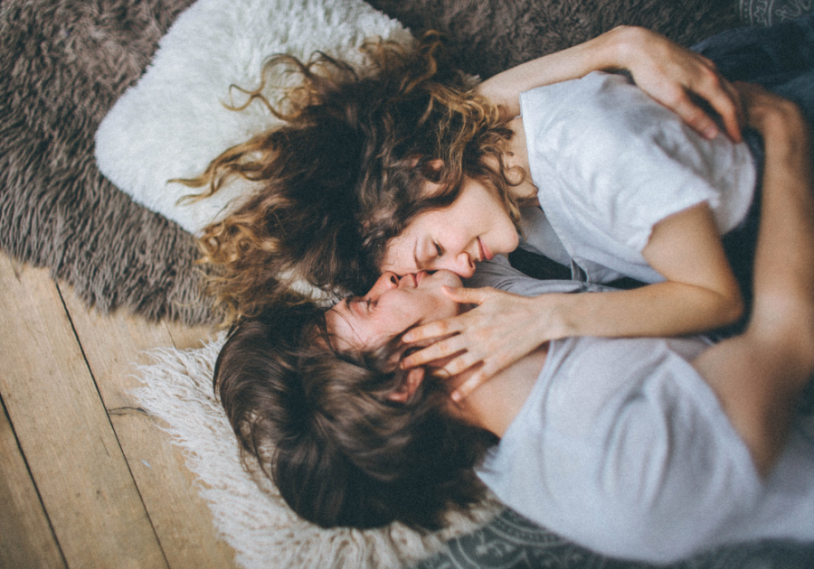 couple snuggling laying on floor Do Guys Like Being Called Handsome