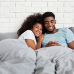 couple smiling talking in bed Bedtime Stories for Your Girlfriend