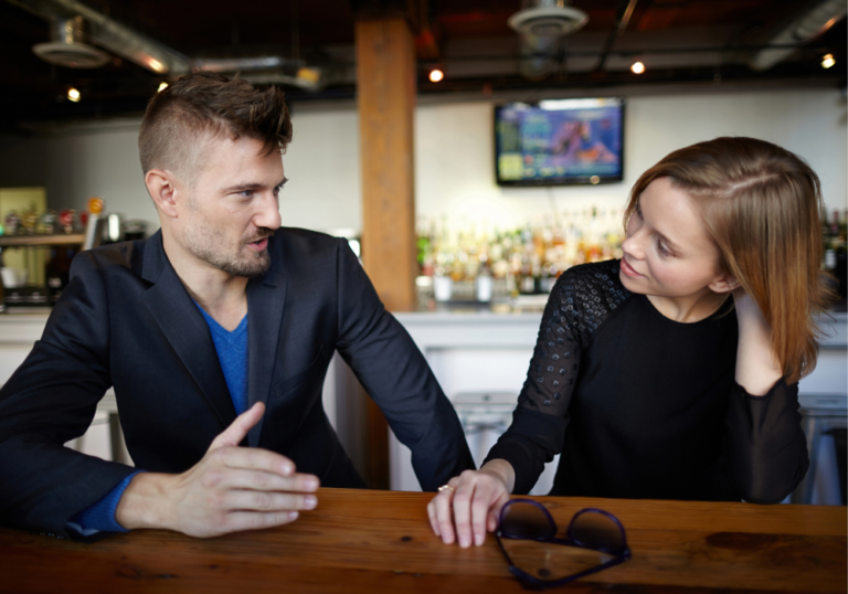 couple sitting at bar talking Couples Quiz Questions