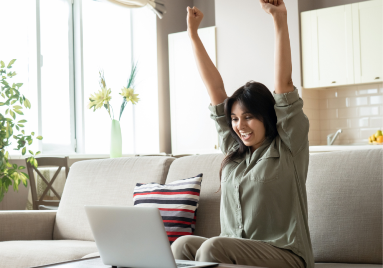 woman raising arms celebrating feeling defeated