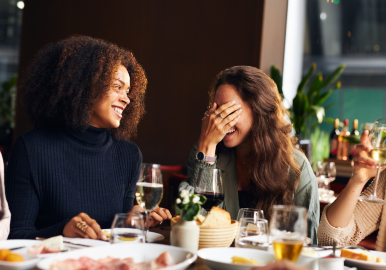 woman laughing at restaurant Funny Jokes To Tell Your Friends