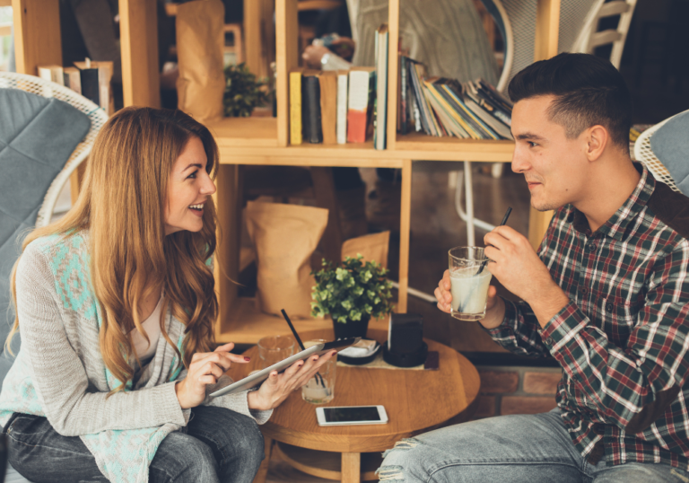 couple sitting for coffee talking Things to Talk About with Your Crush