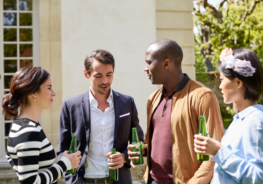 group outdoors talking and drinking beers How to Make Friends in Your 30s