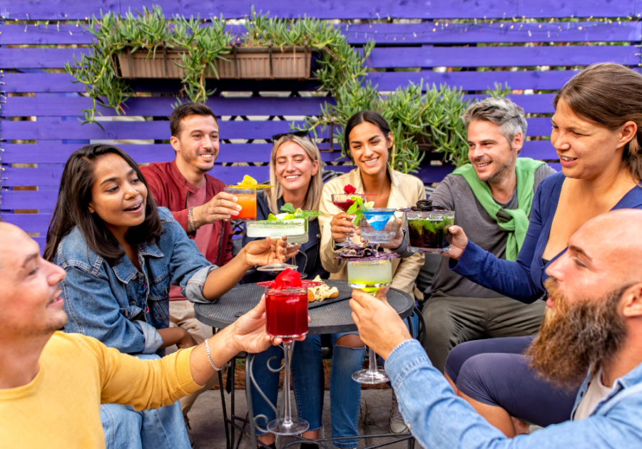 group outdoors talking and drinking How to Make Friends in Your 30s