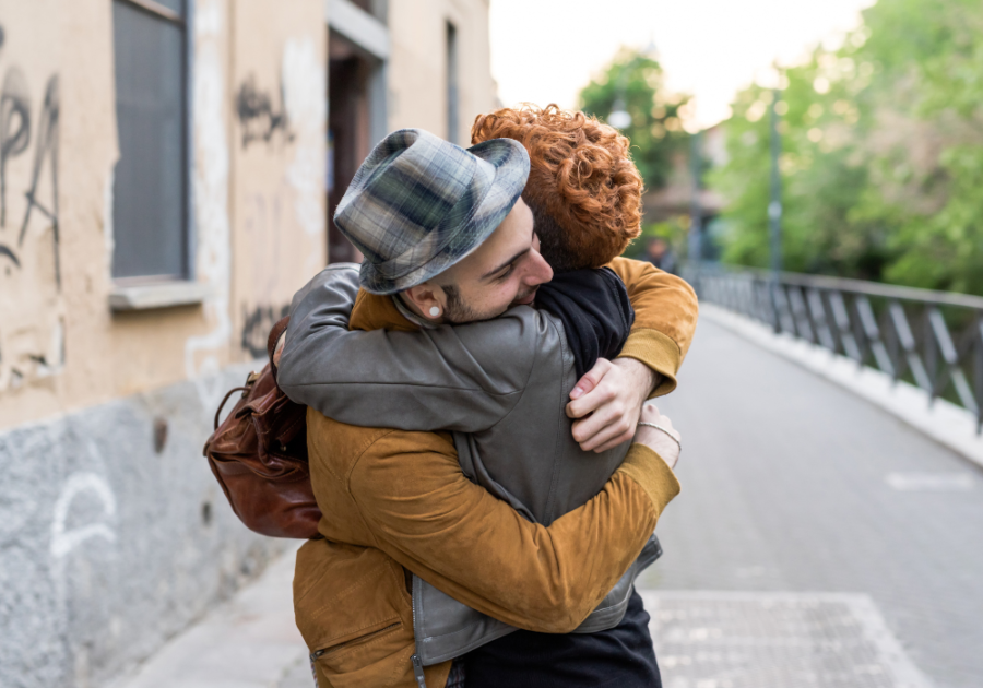 couple hugging outdoors Why Do Girls Hug Guys Around the Neck