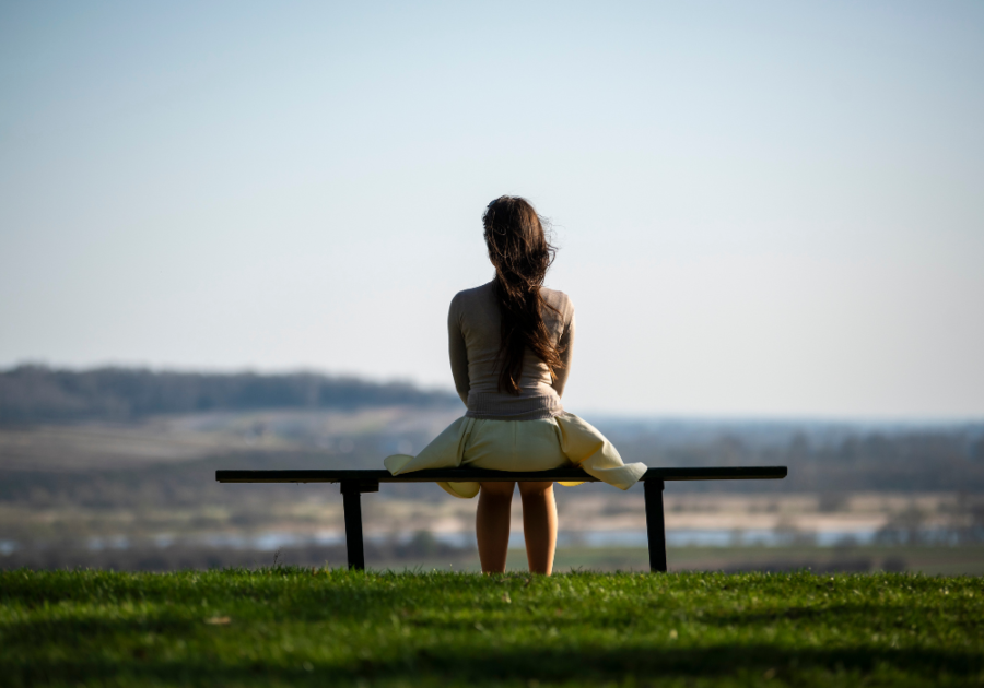 woman sitting on bench alone signs you will never fall in love