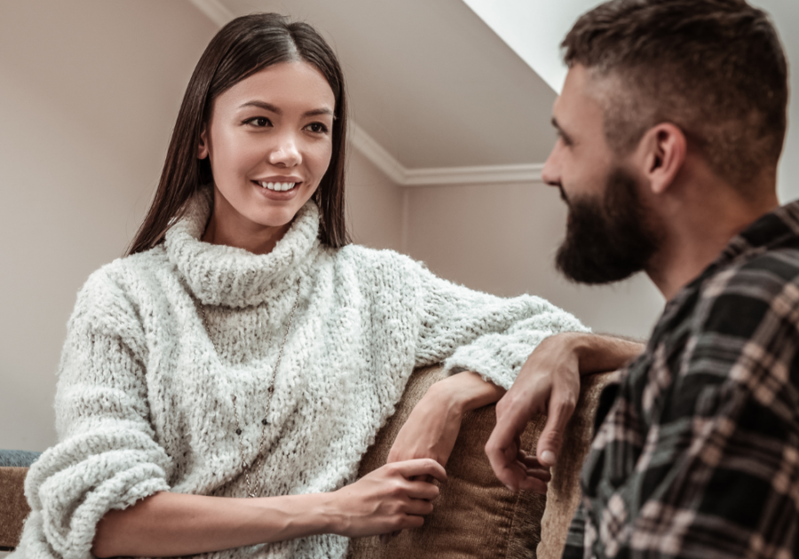 couple talking on sofa woman smiling  poems about beautiful women