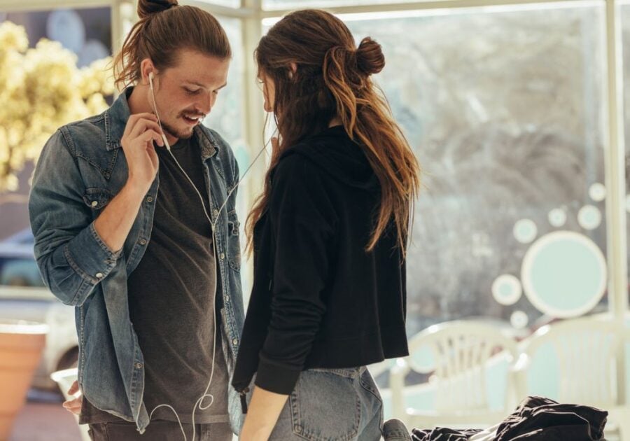 couple standing and talking Signs a Sagittarius Man Has Feelings for You