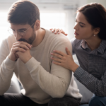 女人sitting by man consoling him a When a Guy Tells You Personal Things About Himself