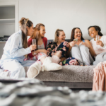 group of women sitting on sofa girls night questions