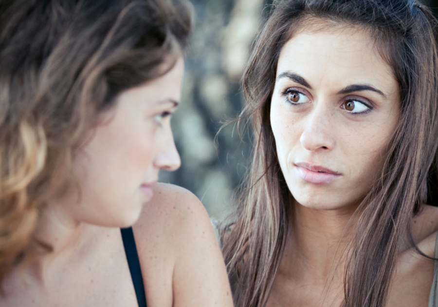 woman staring at each other closely Symptoms of Bisexuality in Females