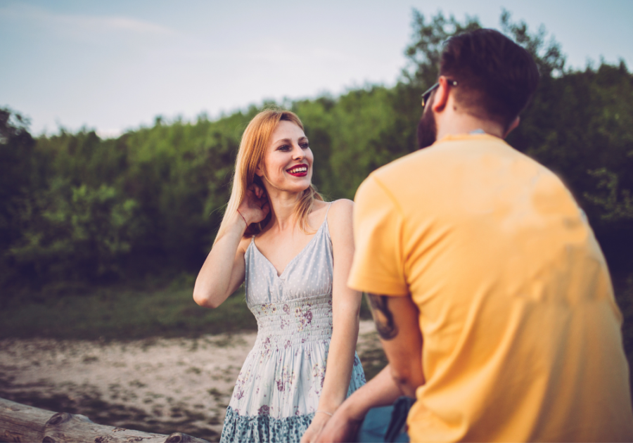 couple talking outside how to Seduce a Man