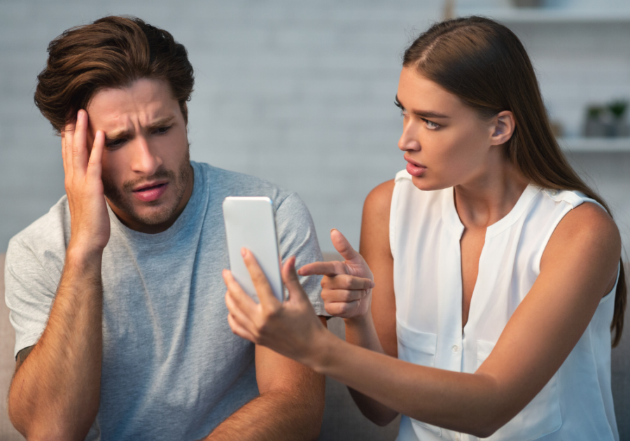 couple looking at phone is sexting cheating