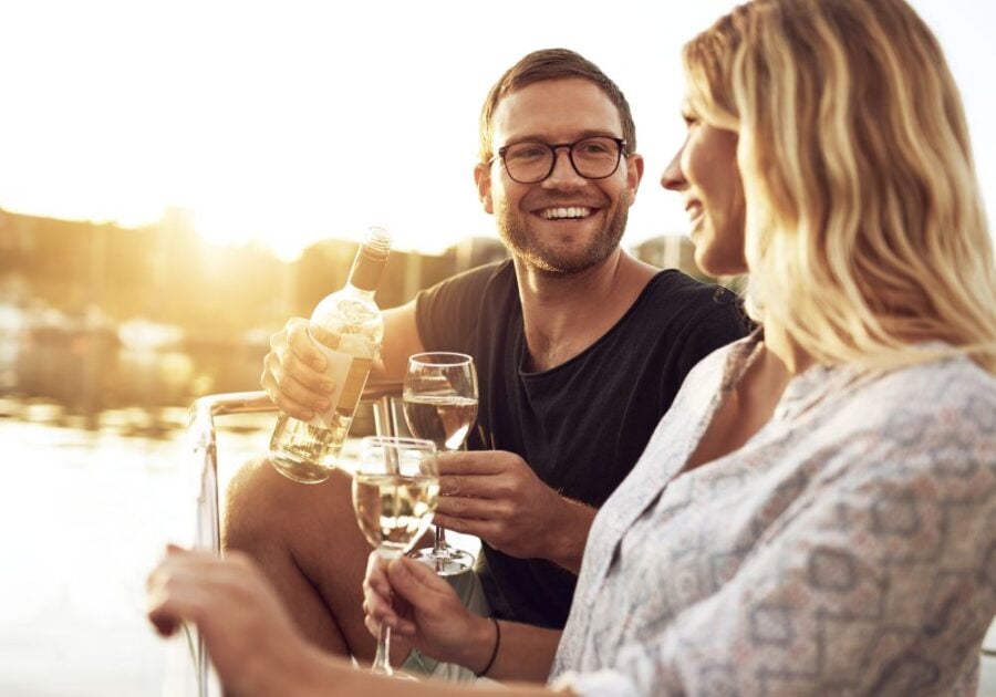 man drinking wine with woman Signs He Wants You Badly Sexually