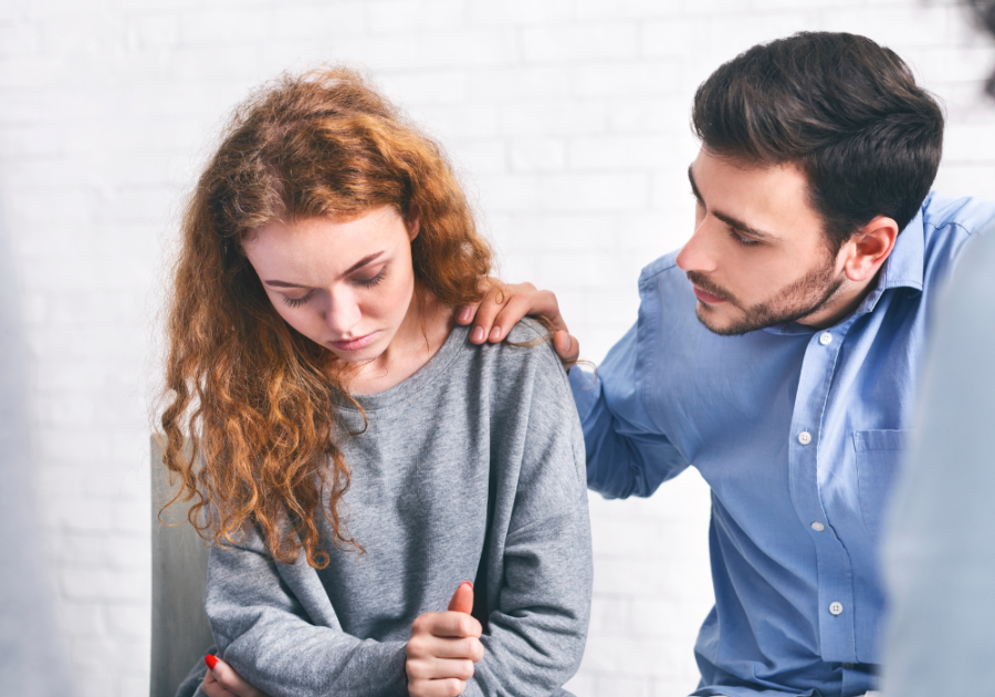 man touching womans shoulder how to apologize Apologize for Cheating