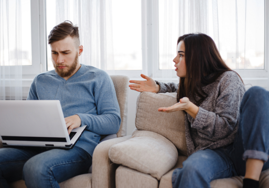 man on computer woman frustrated trying to talk to him what lack of intimacy does to a woman