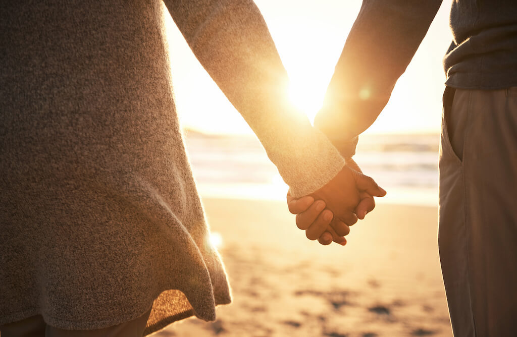 holding hands while watching the sunset ways to tell if a man over 50 likes you
