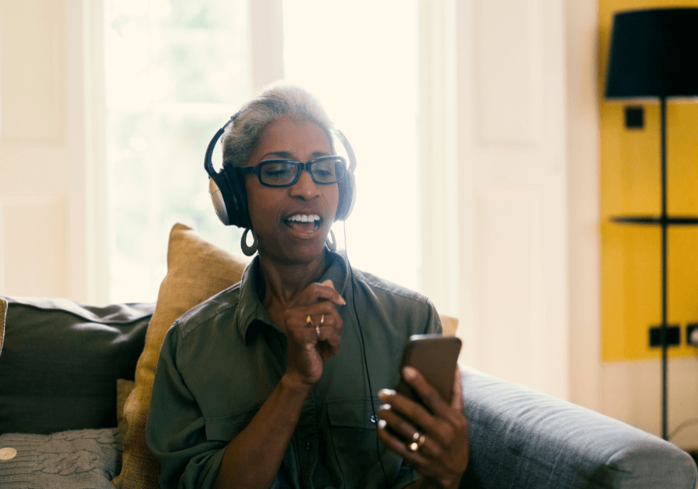 mature woman having fun while listening to music best ways to listen to music
