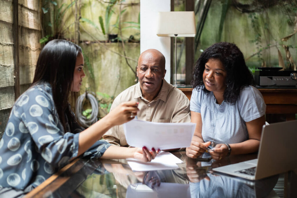 couple discussing finances with woman emotional signs you need to retire