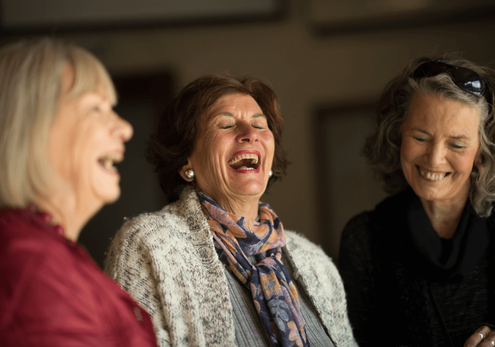 senior women laughing hard trivia for seniors