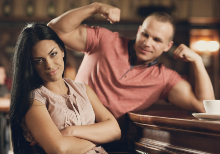 man trying to show off muscles red flags in men
