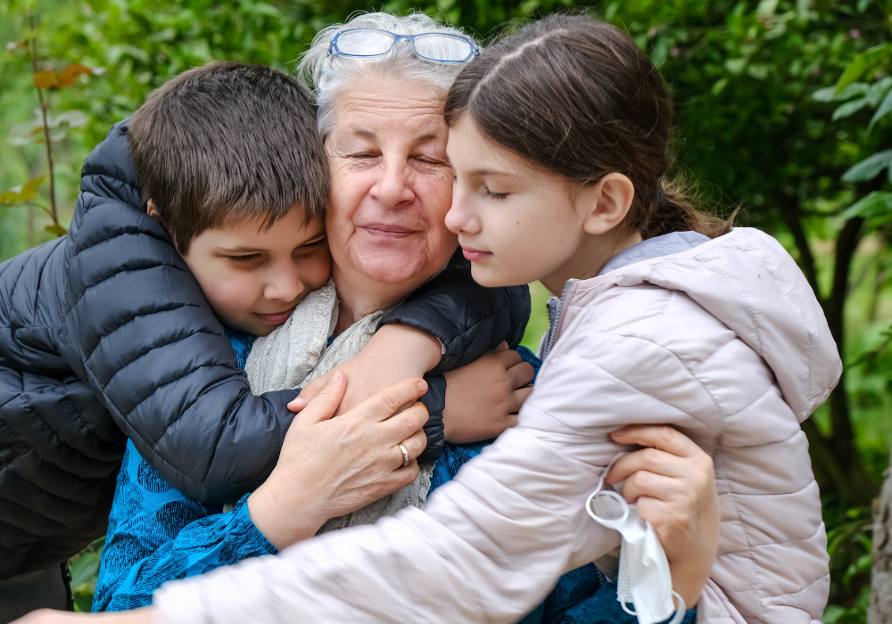 how to cope with not seeing your grandchildren older woman hugging children