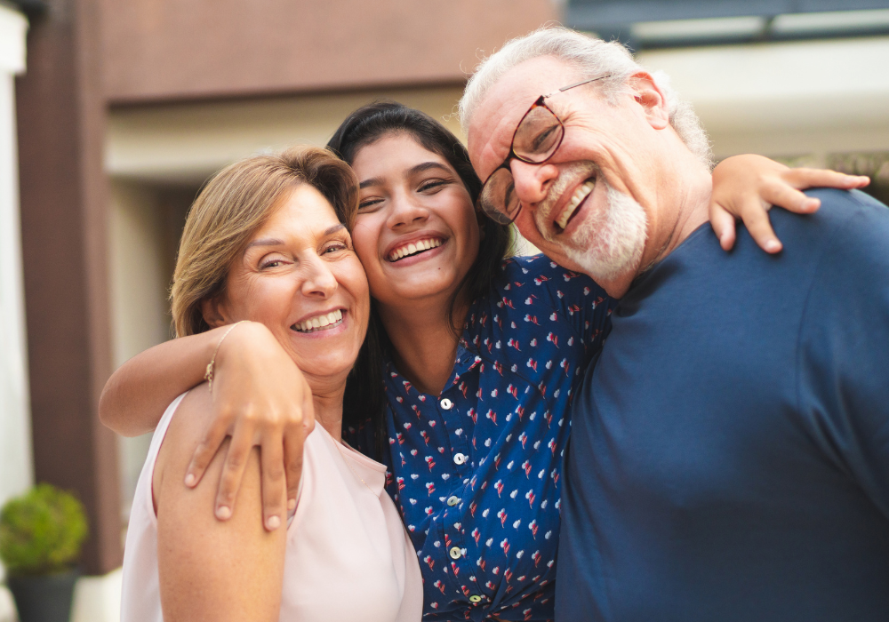 older couple group hug with young woman Birthday Wishes for Your Granddaughter